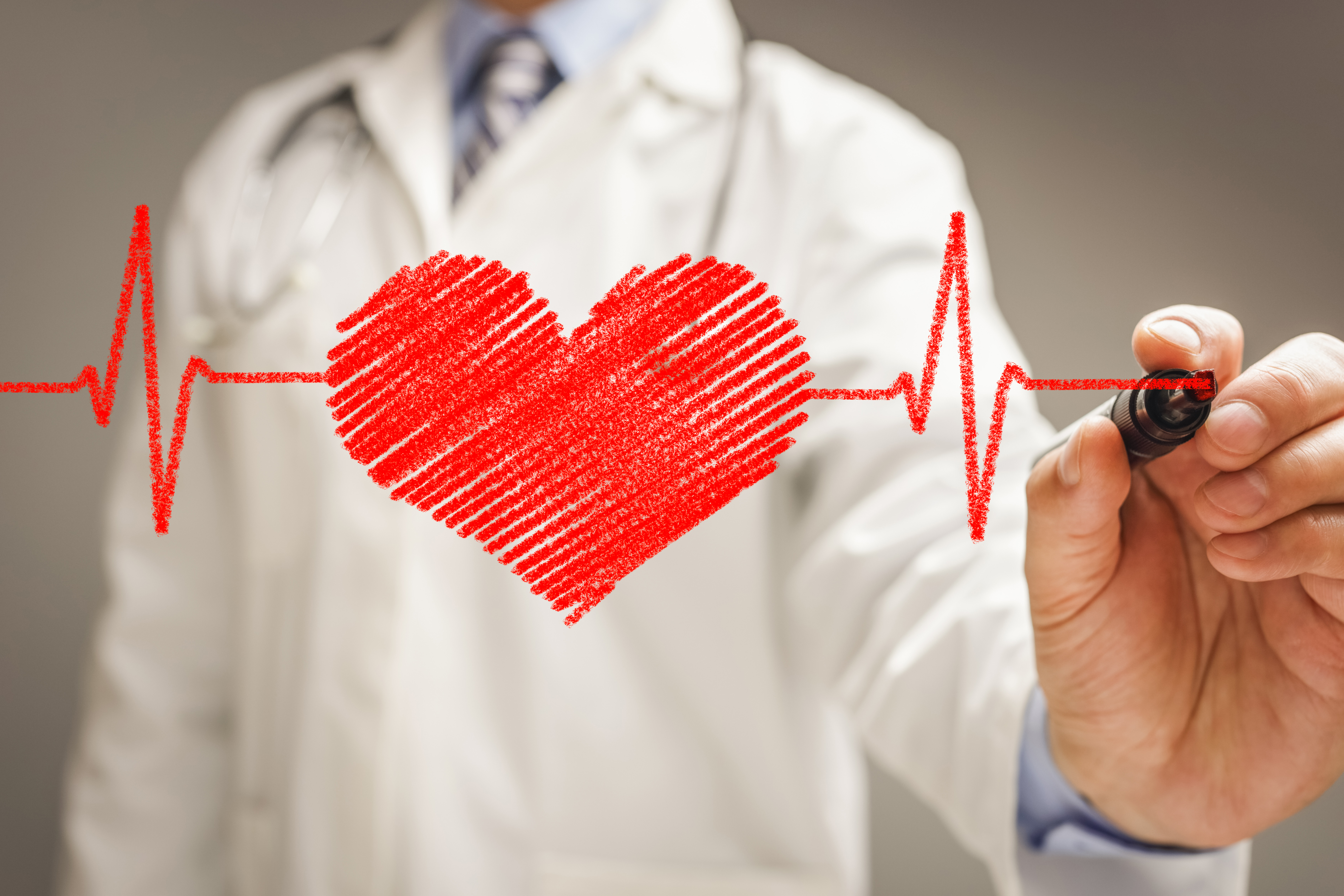 Doctor drawing ecg heartbeat chart